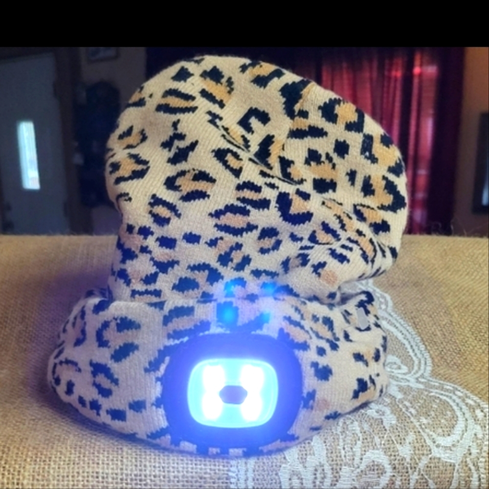 Night scope rechargeable light in a leopard print winter hat